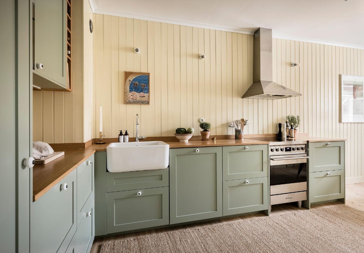 Timeless Charm and Contemporary Design in a 1930s Duplex Apartment 4 yellow and green kitchen