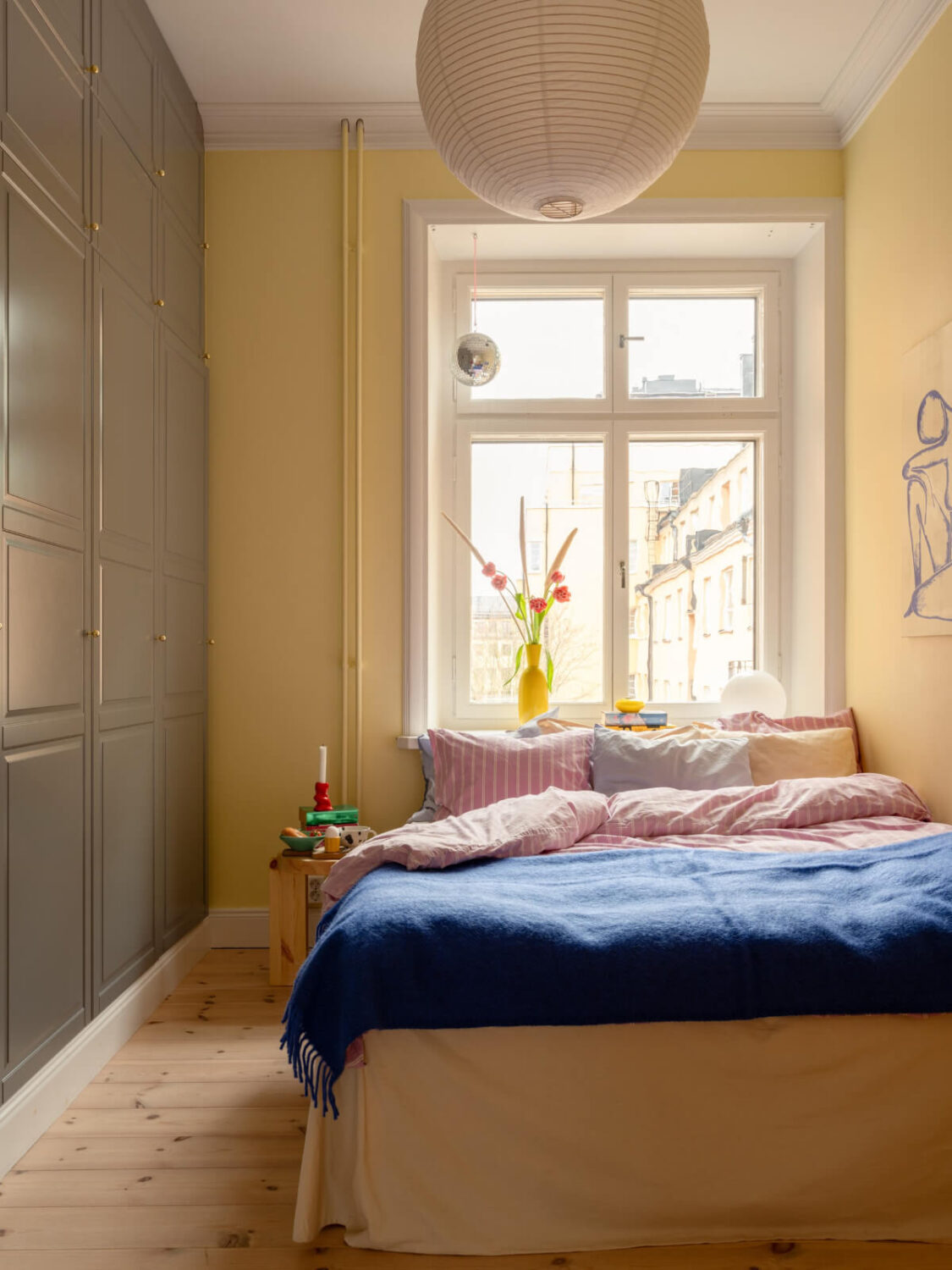 Best of 2025: Bedrooms 25 yellow bedroom with gray floor-to-ceiling built in wardrobes