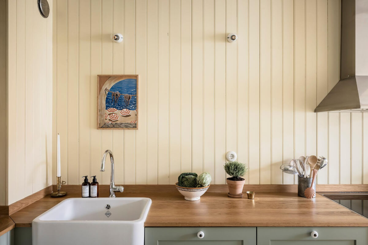 Timeless Charm and Contemporary Design in a 1930s Duplex Apartment 3 yellow paneling butler sink wooden countertop