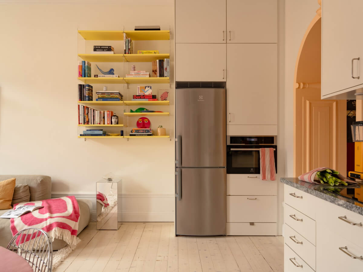 Cheerful Color Accents in a One-Bedroom Stockholm Apartment 8 yellow shelves