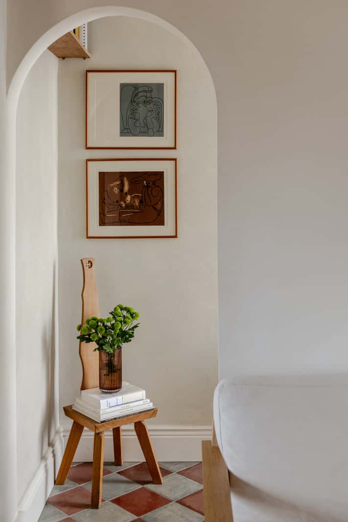 Reclaimed Materials and Custom Storage in a Serene London Home 6 arched doorway hall with checkerboard tiles