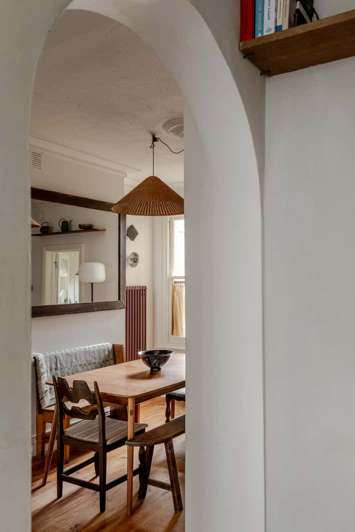 Reclaimed Materials and Custom Storage in a Serene London Home 8 arched doorway