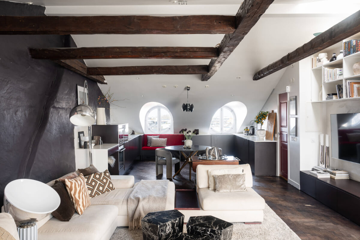 A Stylish Black and White Penthouse Apartment in Stockholm 3 attic apartment exposed beams black wall A Stylish Black and White Penthouse Apartment in Stockholm