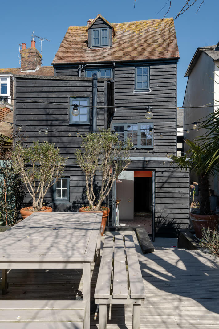 Colorful Design and Historic Features in a Charming English Home 27 back garden wooden house rye east sussex nordroom