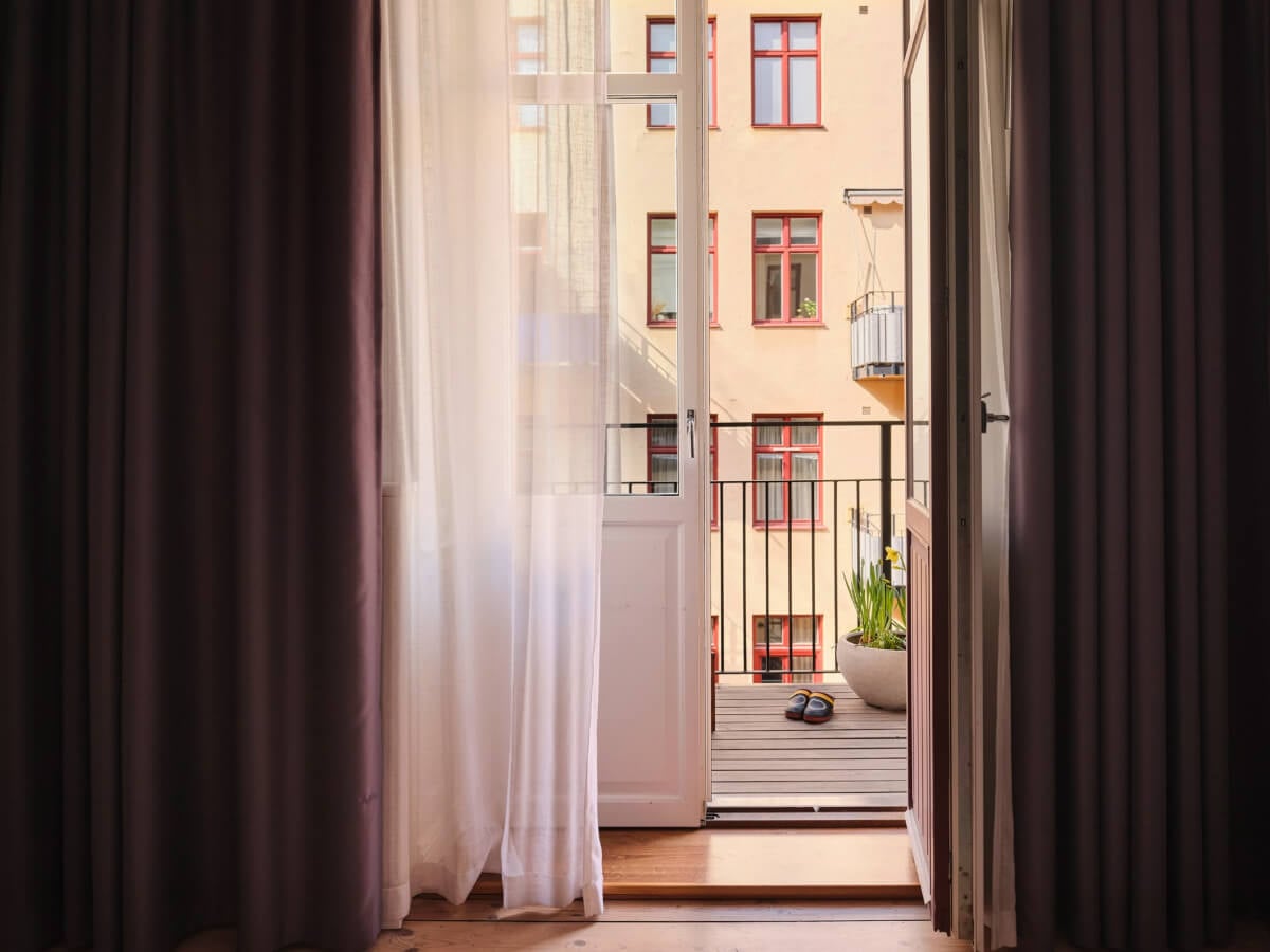 A Spacious Turn-of-the-Century Apartment with Nice Color Accents 17 balcony doors