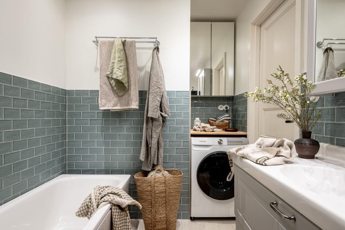 A Natural Color Palette, Period Features, & Grand Rooms in a Swedish Home 43 bathroom blue-green tiles