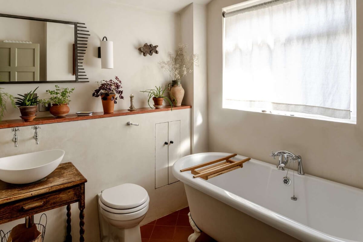 Reclaimed Materials and Custom Storage in a Serene London Home 17 bathroom clawfoot bath storage ledge