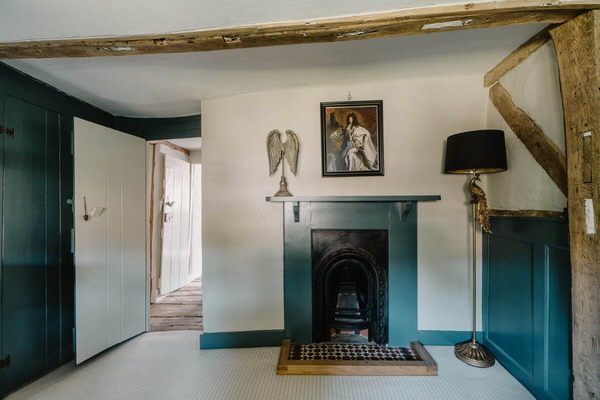 Serene Colors and Historic Elements in an Elizabethan Home in Wiltshire 16 bathroom fireplace