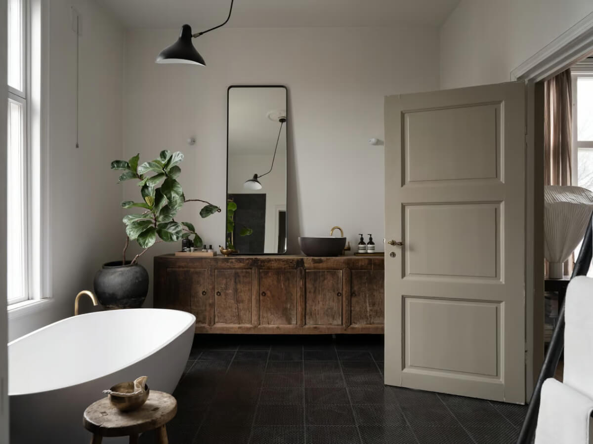 Artilleriet Co-Founder is Selling Her Art Nouveau Villa in Sweden 18 bathroom freestanding bath reclaimed cabinet black sink