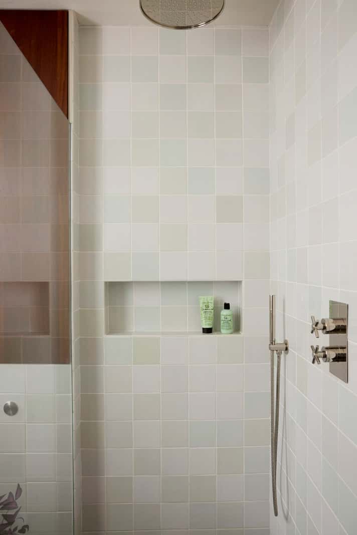 Bespoke Oak Cabinets and Plaster Walls in a London Garden Apartment 21 bathroom light colored tiles storage niche