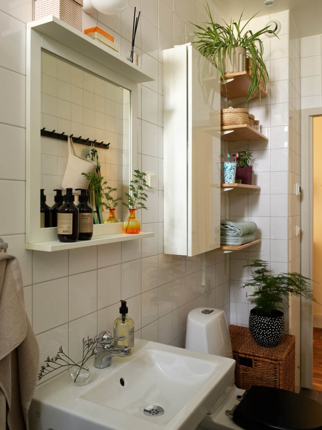 A Nature-Inspired Color Palette in a Stockholm Apartment 25 bathroom shelves