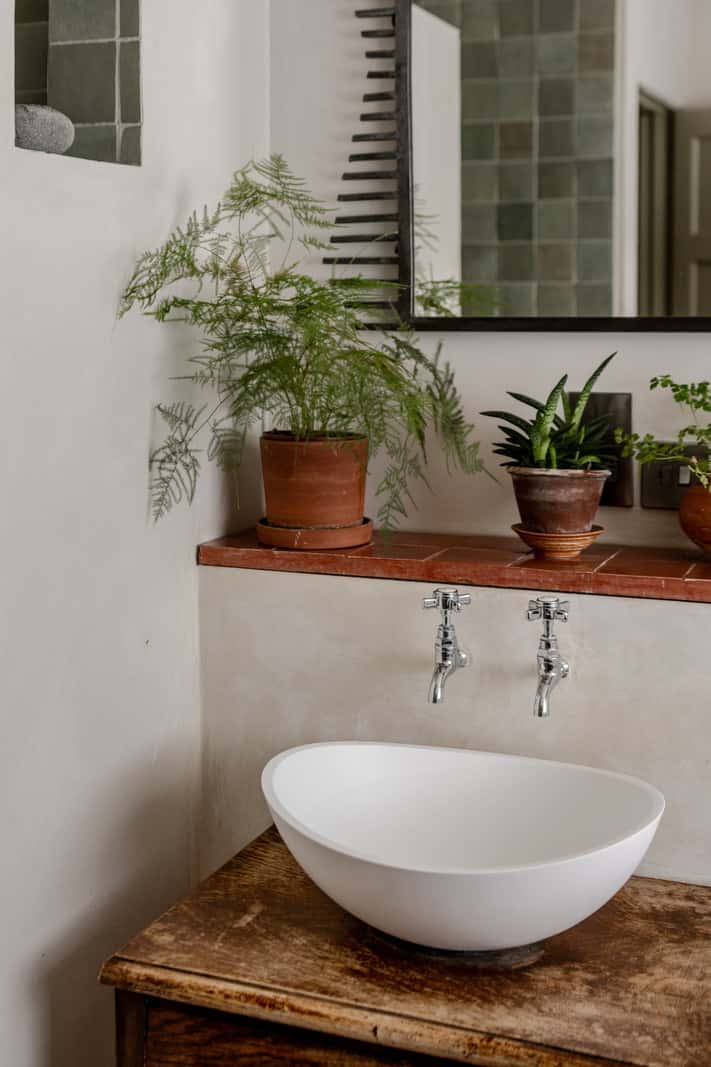 Reclaimed Materials and Custom Storage in a Serene London Home 19 bathroom sink tiled storage ledge