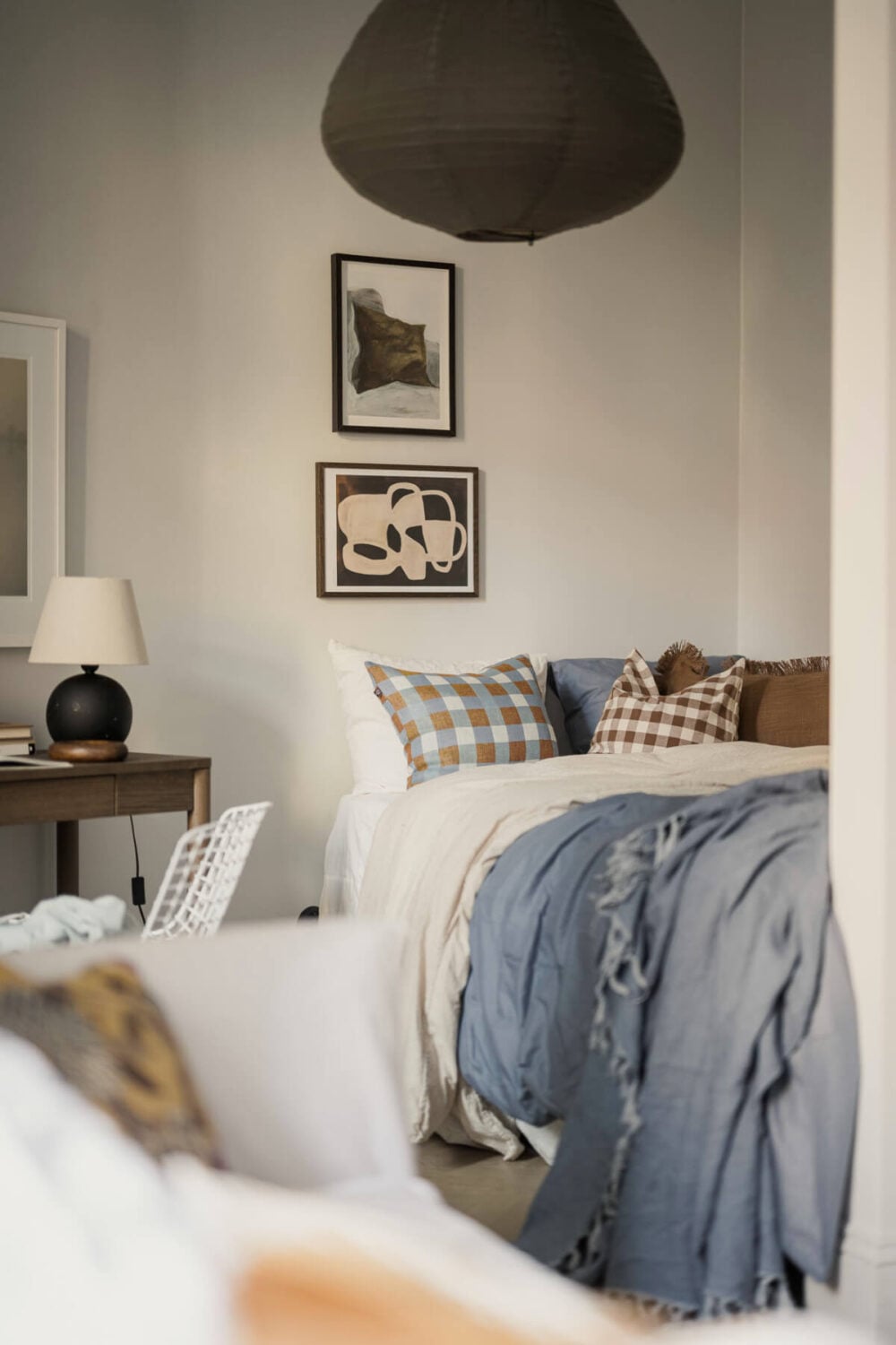 A Stylish Swedish Studio Apartment with a Blue Kitchen 18 bed niche layered textiles