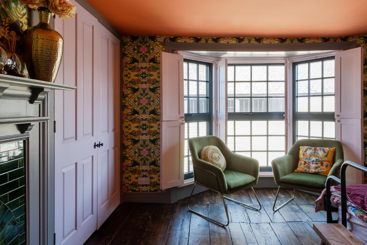 Colorful Design and Historic Features in a Charming English Home 17 bedroom bay window rustic floorboards