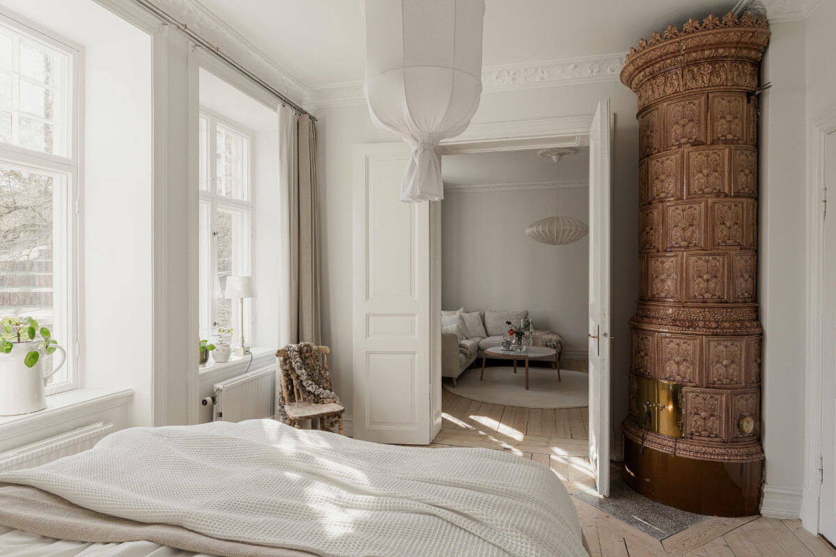 A Bright Swedish Apartment with Period Features and a Green Kitchen 20 bedroom brown firepalce