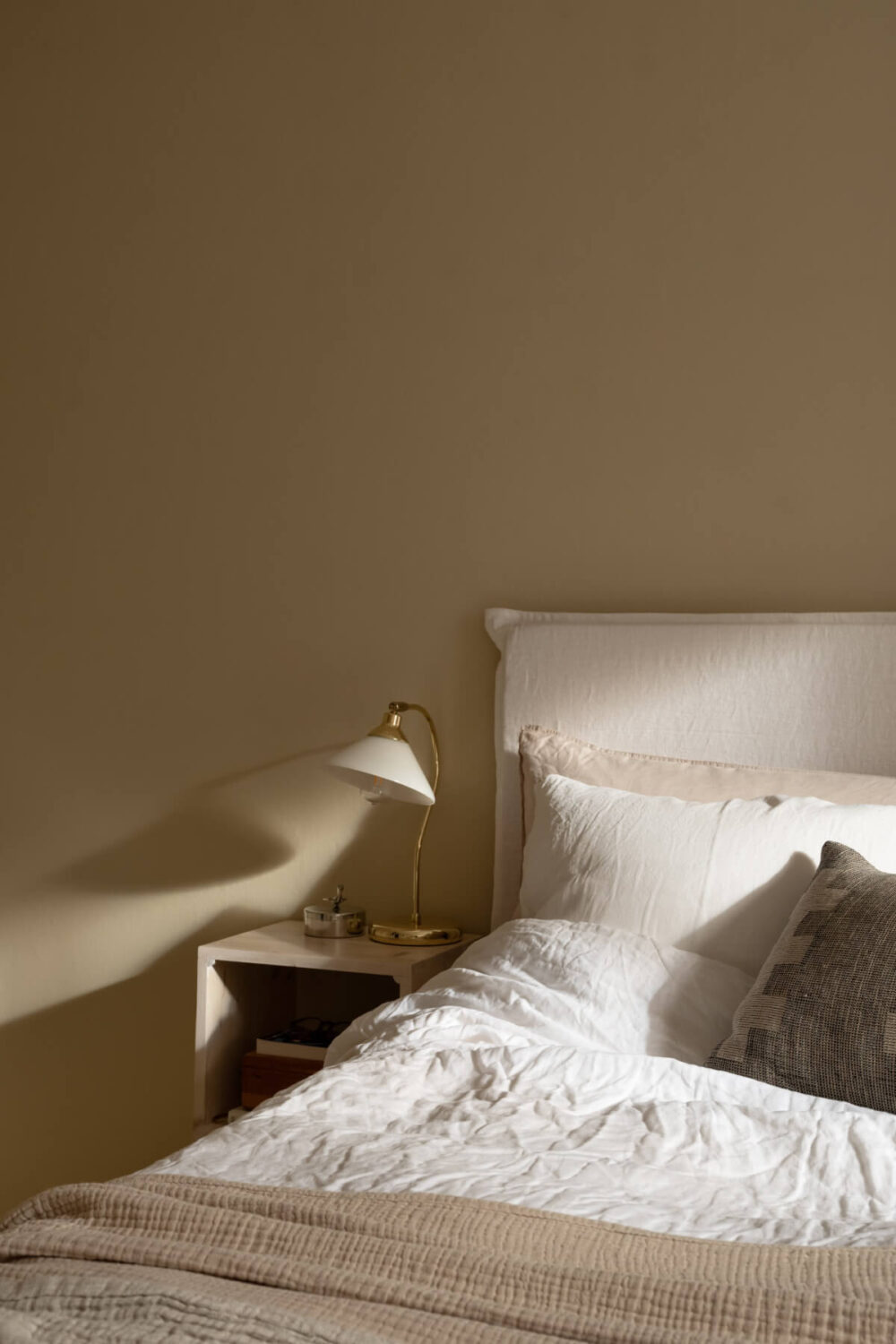 A Beige Color Palette and Built-in Bookshelves in a 1920s Apartment 13 bedroom detail