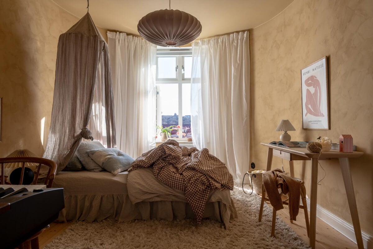 A Natural Color Palette, Period Features, & Grand Rooms in a Swedish Home 31 bedroom rounded wall dark beige plaster walls