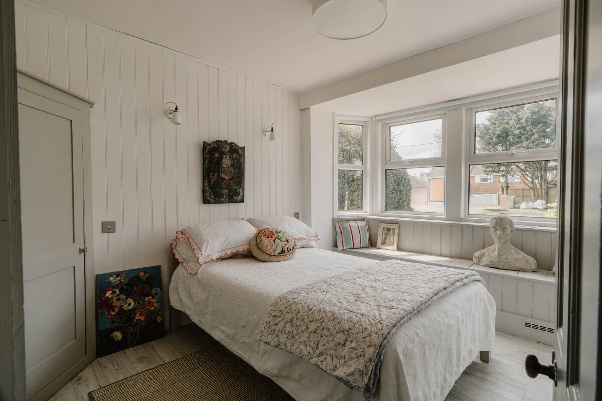 A Bright English Seaside Home Owned by Artists 21 bedroom tongue and groove paneling window seat