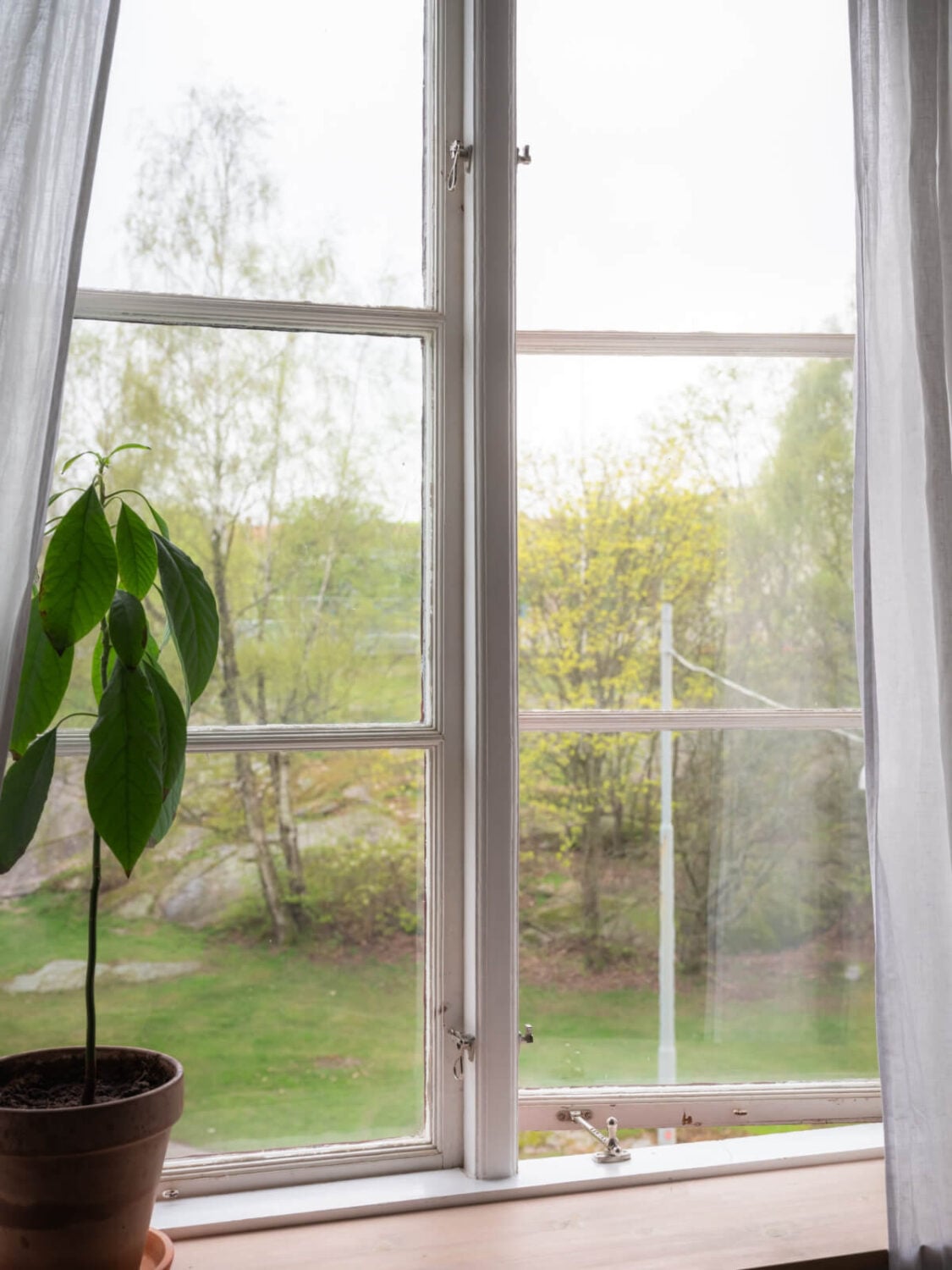 A Soft Color Palette and a Charming Kitchen in a Swedish Apartment 23 bedroom window