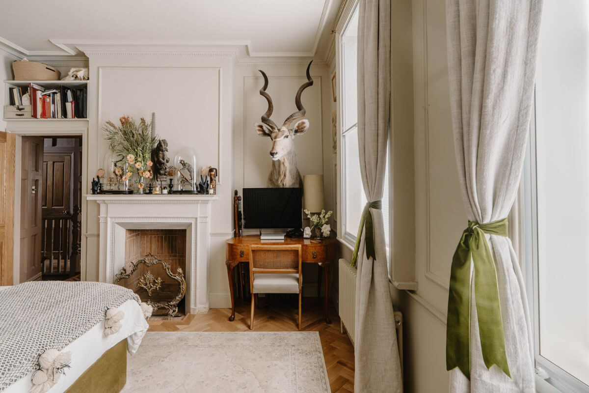 A Classy Apartment on the Top Floors of a 19th-Century Building 9 bedroom with fireplace and small desk
