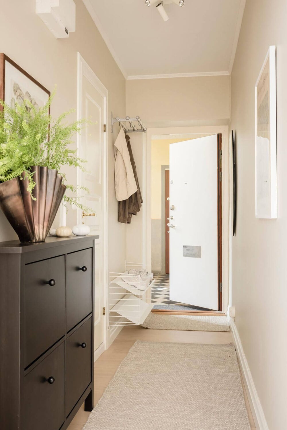 A Bright One-Bedroom Apartment with a Large Balcony 31 beige walls hall shoe storage cabinet A Bright One-Bedroom Apartment with a Large Balcony
