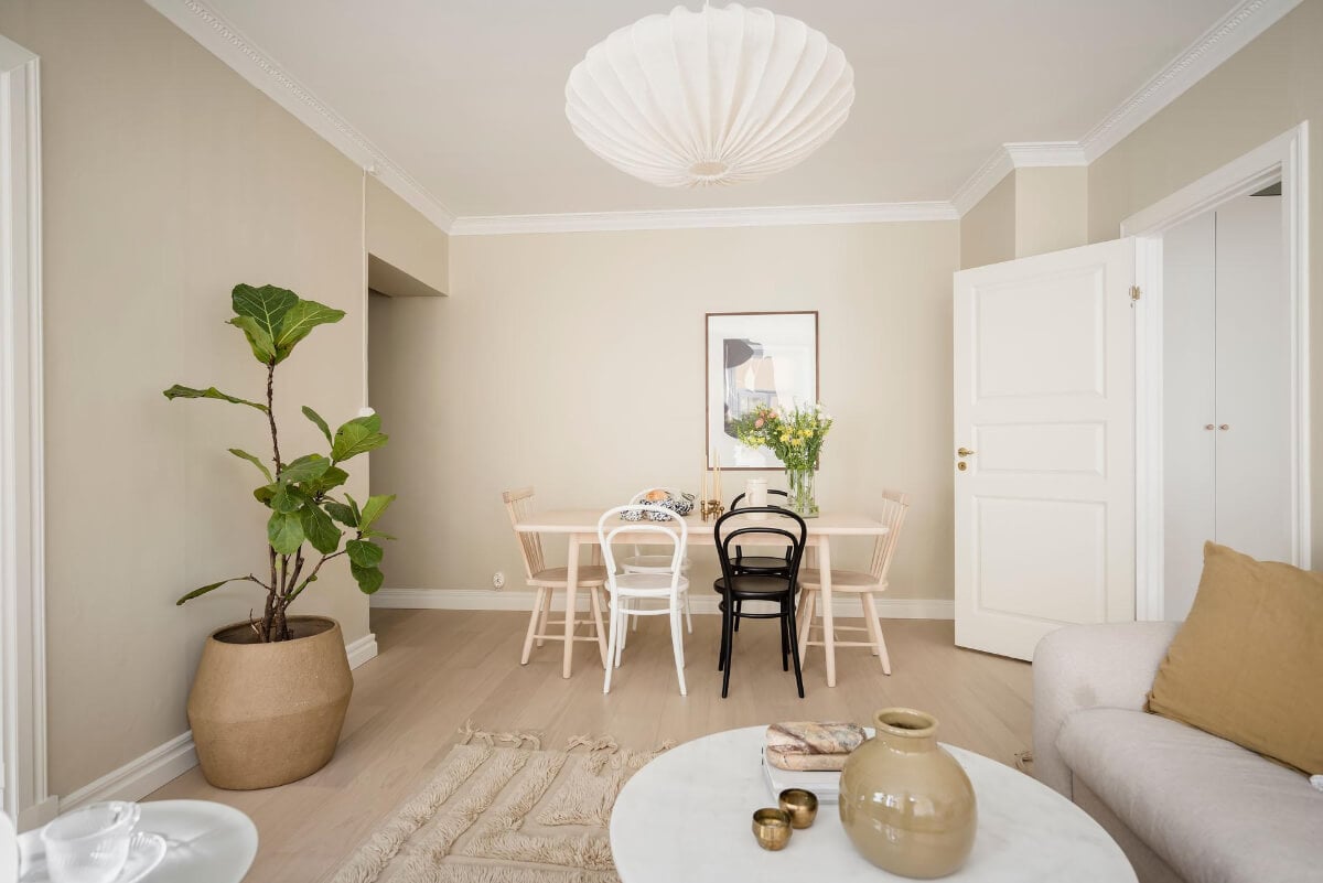A Bright One-Bedroom Apartment with a Large Balcony 7 beige walls living room dining table