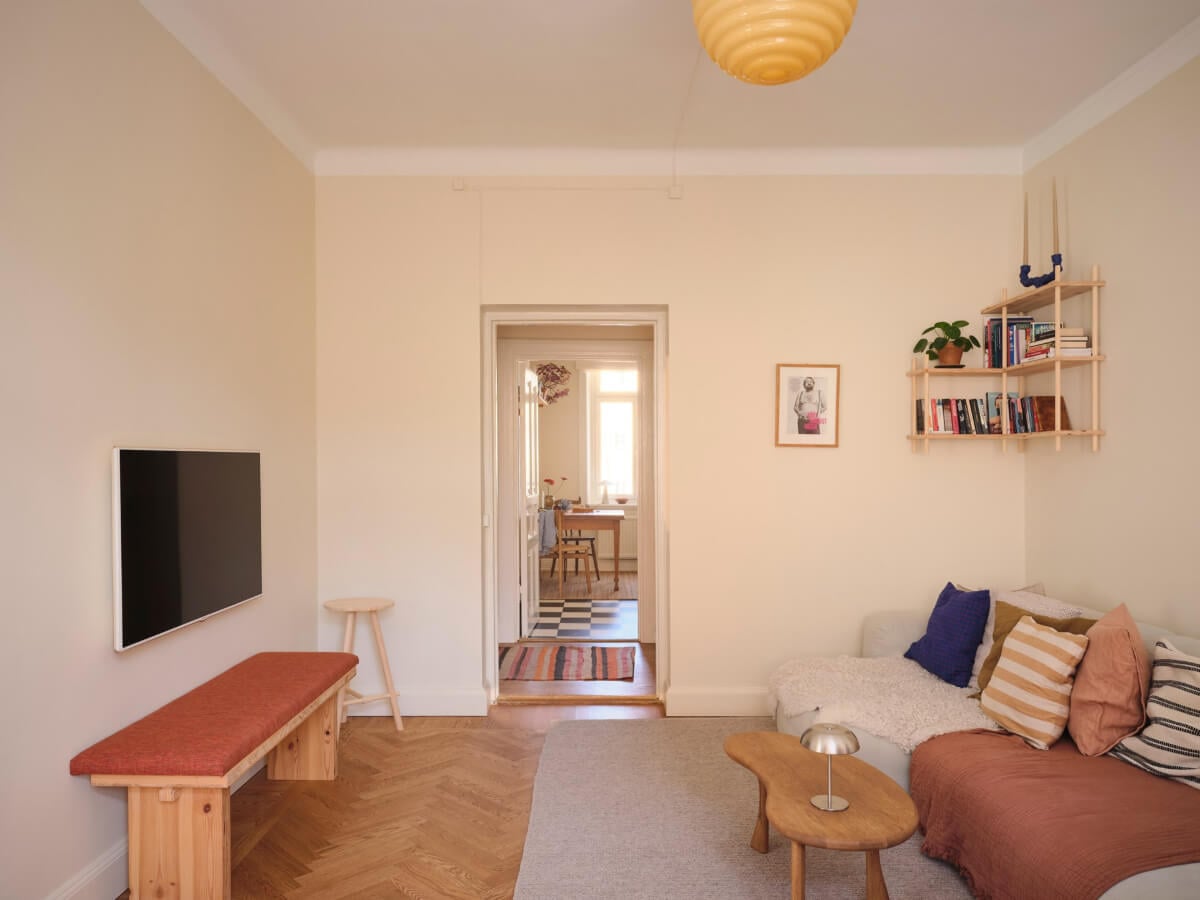 Warm, Natural Light in a Renovated Turn-of-the-Century Apartment 5 beige-yellow walls living room