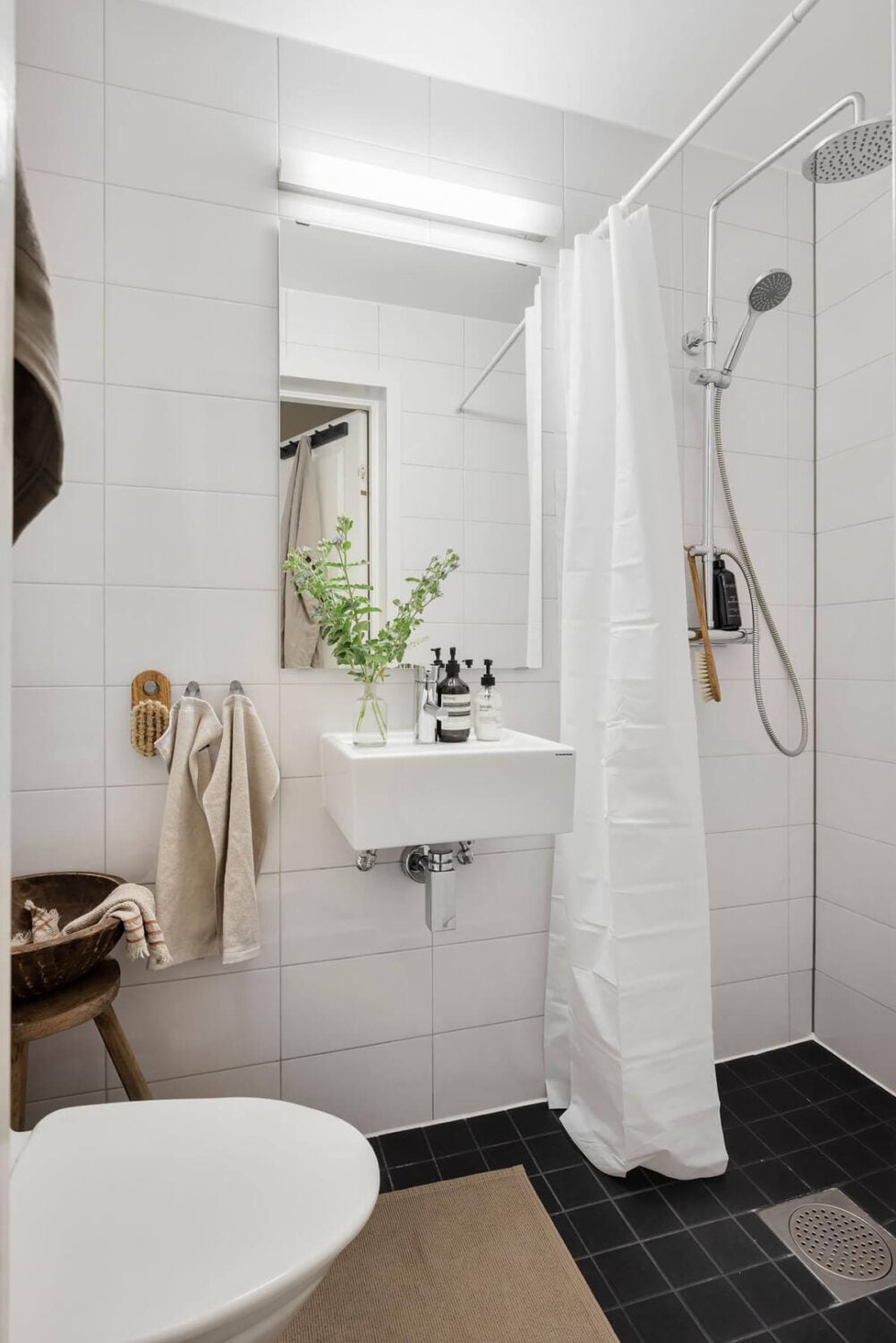 A Bright One-Bedroom Apartment with a Large Balcony 30 black and white bathroom