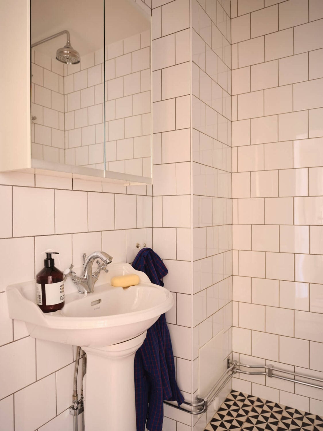 Warm, Natural Light in a Renovated Turn-of-the-Century Apartment 24 black and white bathroom