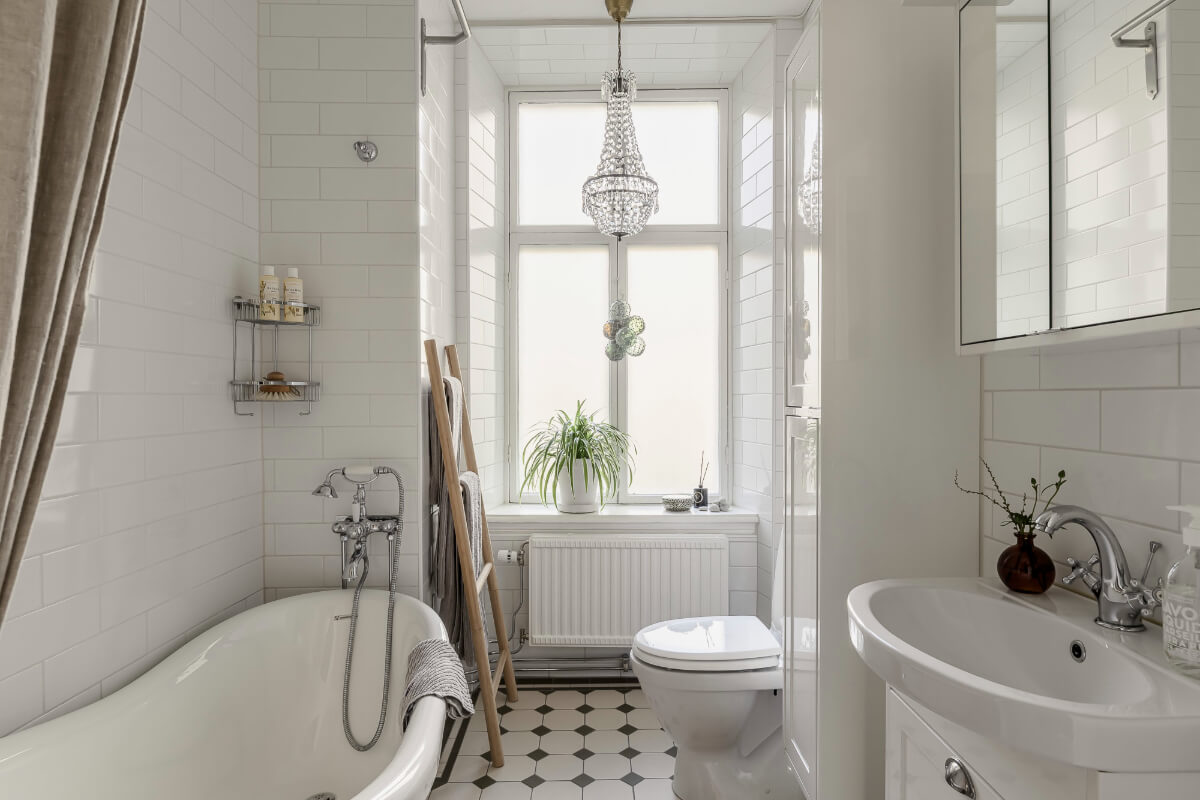 A Bright Swedish Apartment with Period Features and a Green Kitchen 24 black and white classic bathroom