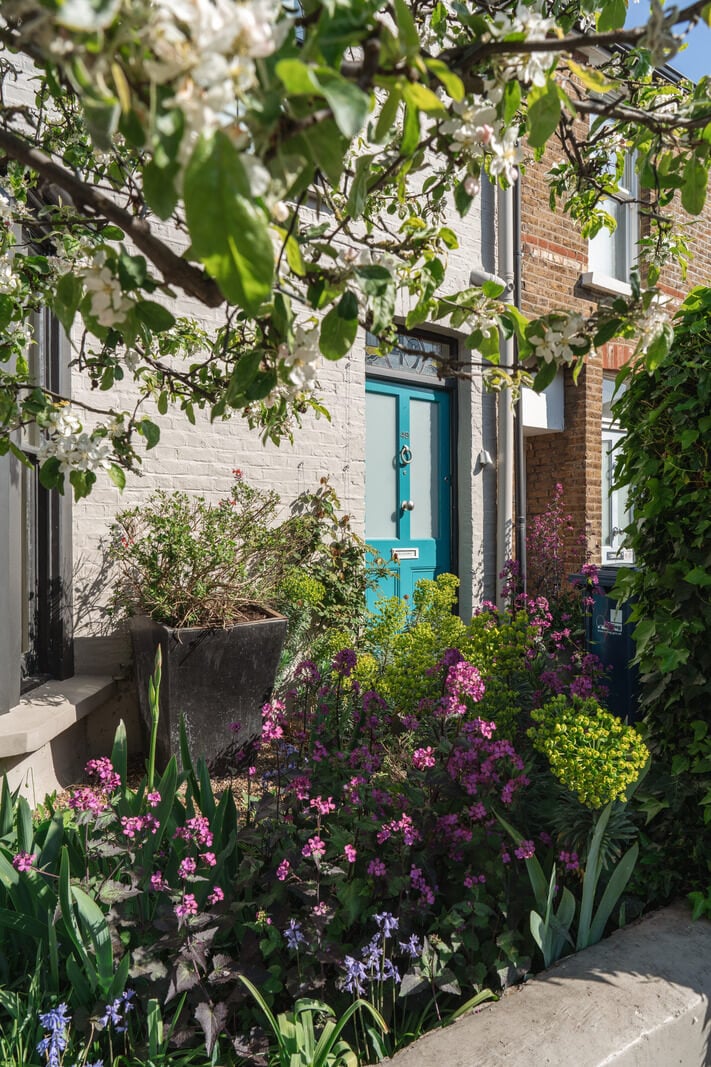 An Edwardian House with Muted Tones, Natural Materials, and a Landscaped Garden 26 blue front door