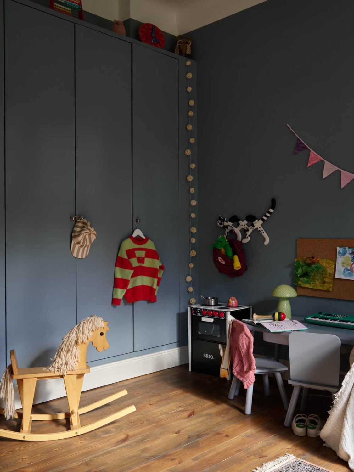 A Nature-Inspired Color Palette in a Stockholm Apartment 20 blue kids bedroom dark wooden floorboards
