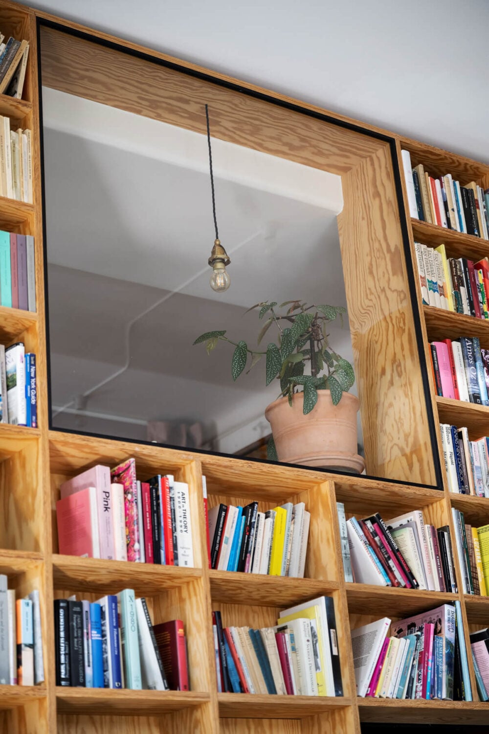 Pale Blue Walls and Huge Windows in a Swedish Loft Apartment 12 bookcases surrounding window