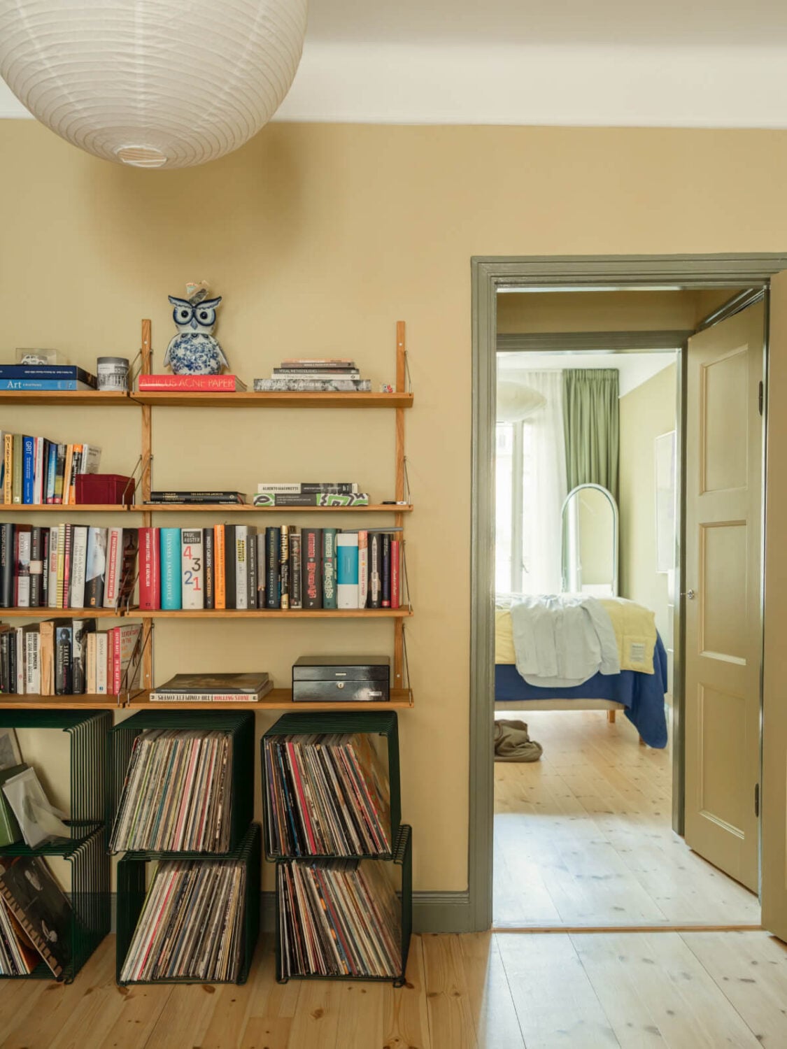 A Yellow and Green Color Palette in a Modern Swedish Apartment 14 bookshelves