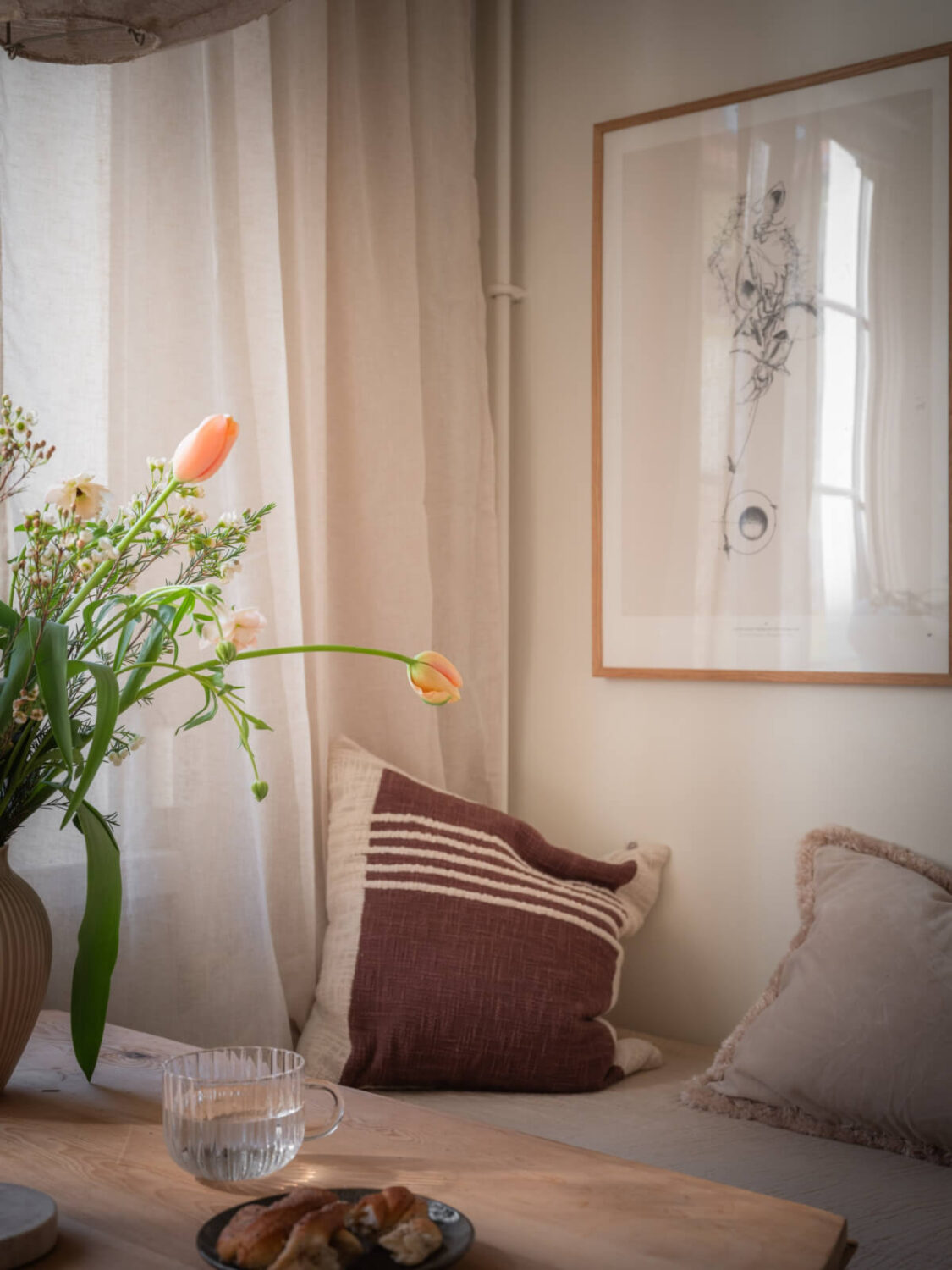 A Light-Colored Studio Apartment with a Cozy Kitchen 10 built-in bench