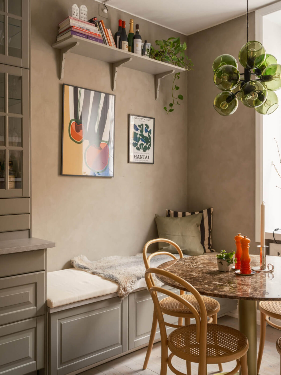 A Muted Palette and a Cozy Kitchen Breakfast Nook in a Swedish Apartment 10 built-in bench round table