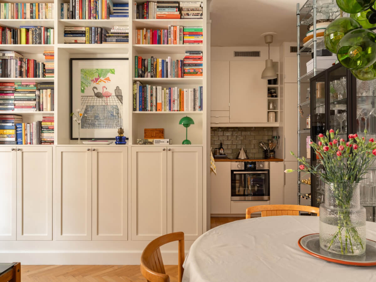 A Small, Cozy Apartment with Built-in Storage and Bookshelves 10 built-in cabinets and bookshelves semi-open floor plan
