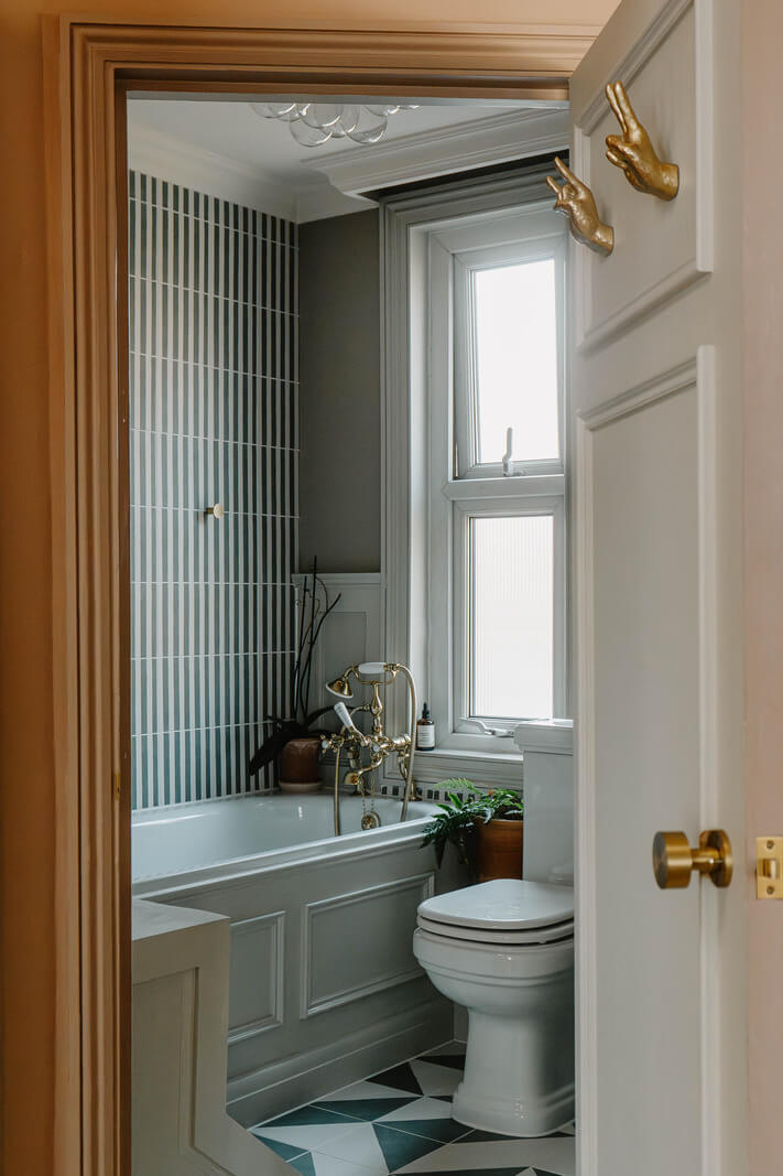 A Classy Apartment on the Top Floors of a 19th-Century Building 12 classic bathroom striped tiles nordroom
