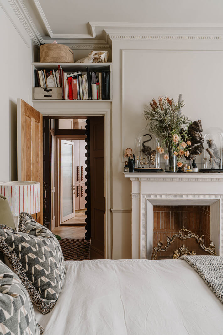 A Classy Apartment on the Top Floors of a 19th-Century Building 10 classic bedroom shelves above door