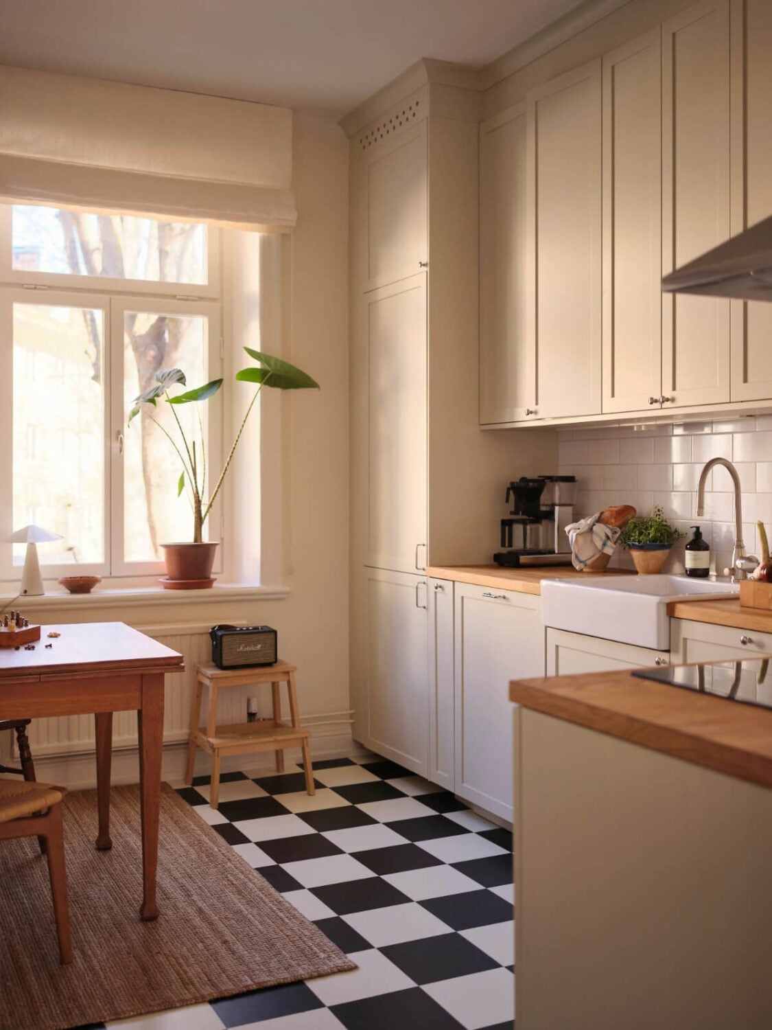 Warm, Natural Light in a Renovated Turn-of-the-Century Apartment 15 classic kitchen checkerboard floor wooden table