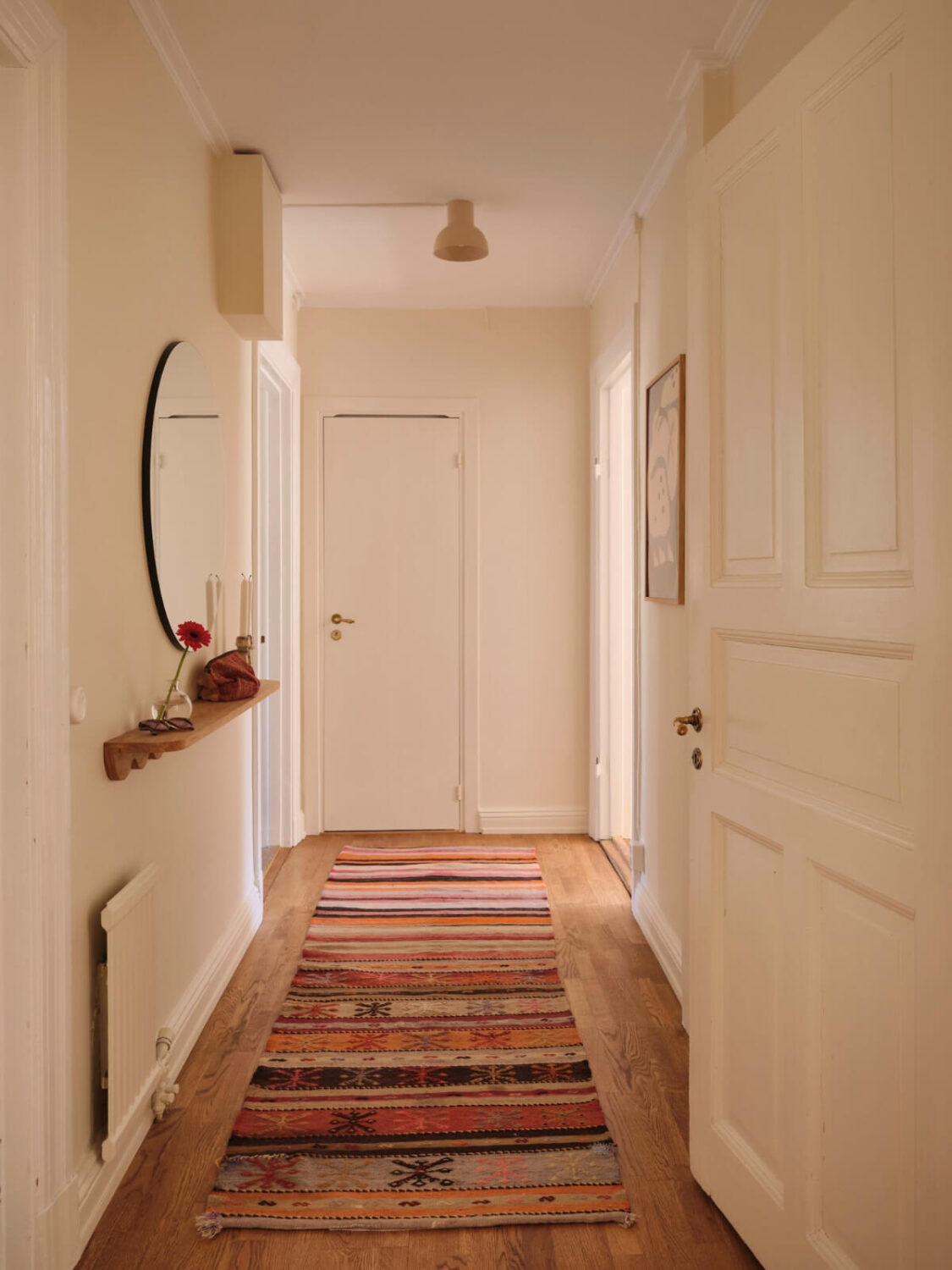 Warm, Natural Light in a Renovated Turn-of-the-Century Apartment 21 colorful runner hall