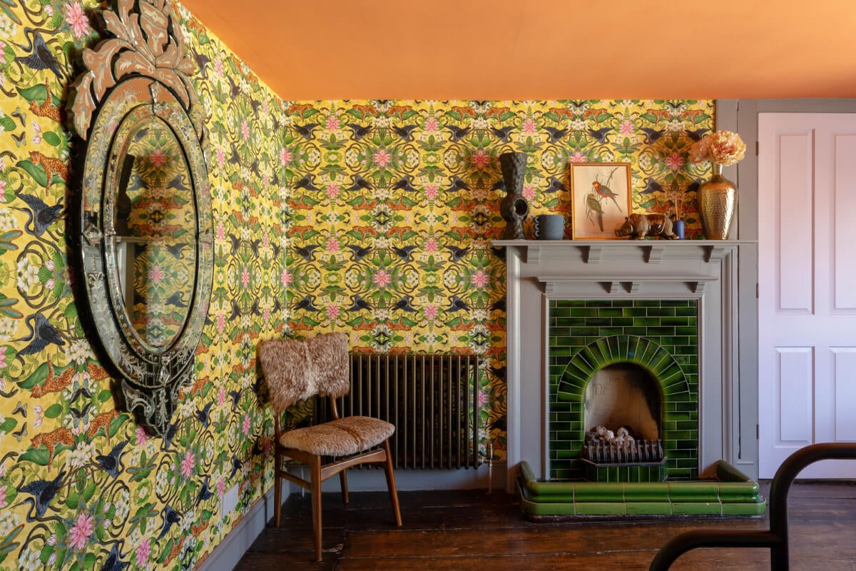 Colorful Design and Historic Features in a Charming English Home 18 colorful wallpaper green tiled fireplace gray mantel nordroom