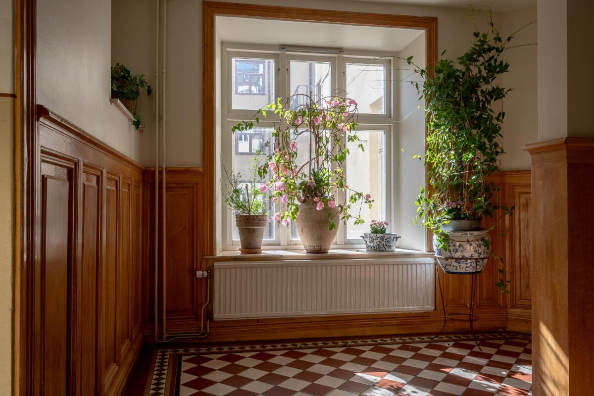 A Natural Color Palette, Period Features, & Grand Rooms in a Swedish Home 47 communal hall checkerboard floor A Natural Color Palette, Period Features, & Grand Rooms in a Swedish Home