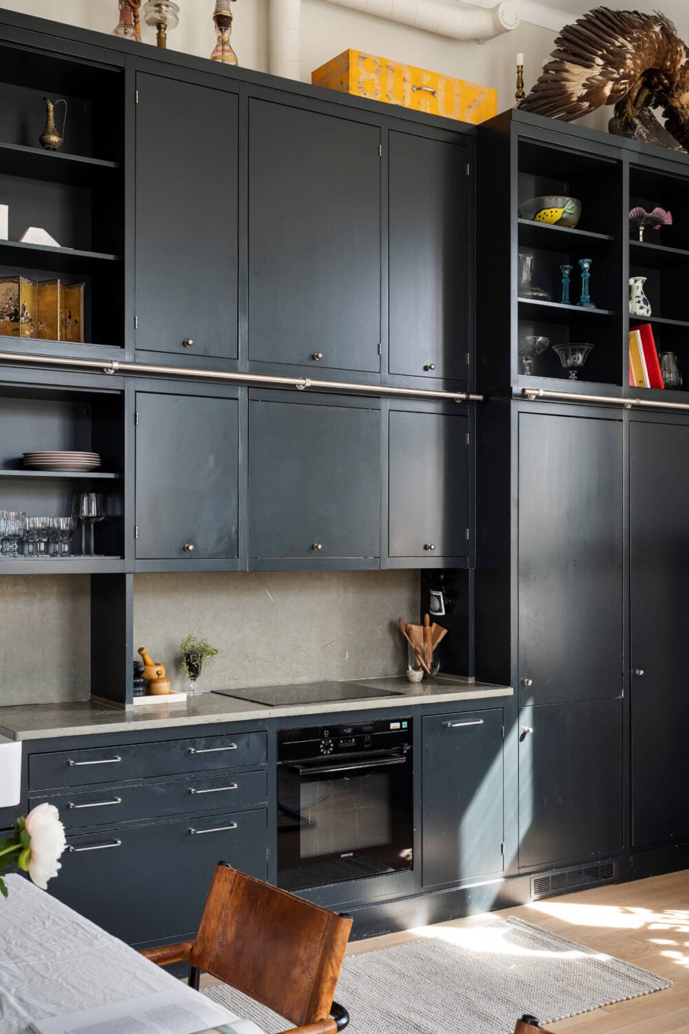 Pale Blue Walls and Huge Windows in a Swedish Loft Apartment 8 dark blue kitchen