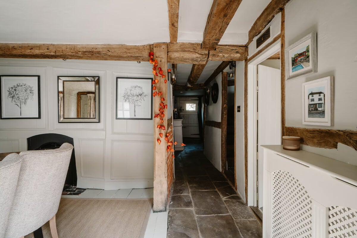 Serene Colors and Historic Elements in an Elizabethan Home in Wiltshire 3 dining room exposed wooden beams
