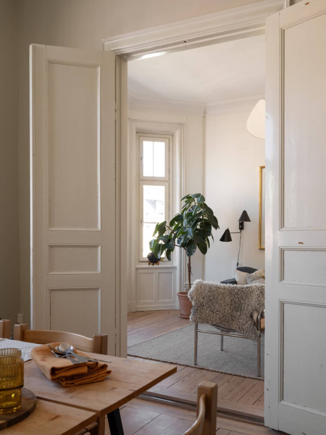 Turn-of-the-Century Charm and Site-Built Storage in a Stockholm Apartment 8 double wooden doors