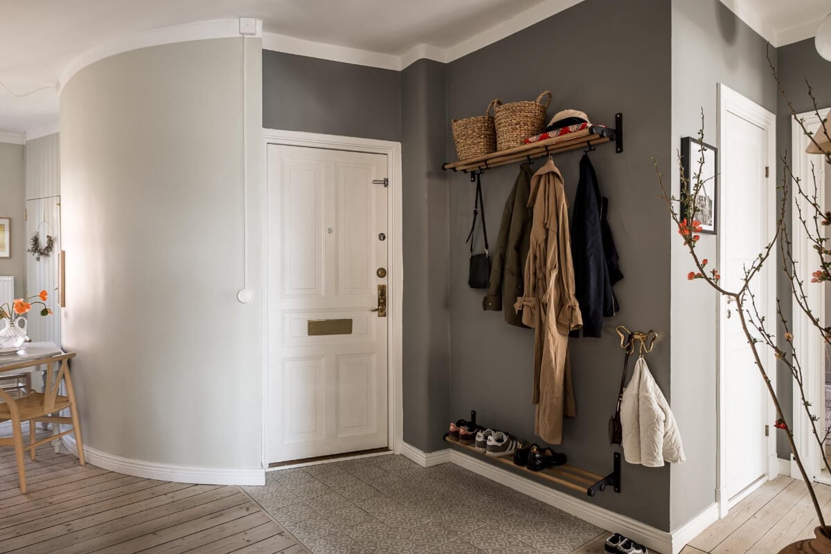 Gray Tones and a Classic Kitchen in a Swedish Apartment 29 entry hall rounded wall Gray Tones and a Classic Kitchen in a Swedish Apartment