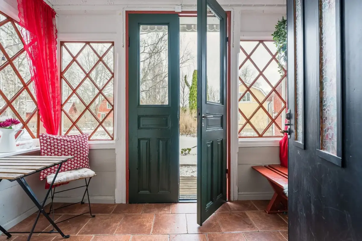 A Cozy Country House in Sweden Filled with Wallpapers 35 entry hall terracotta floor
