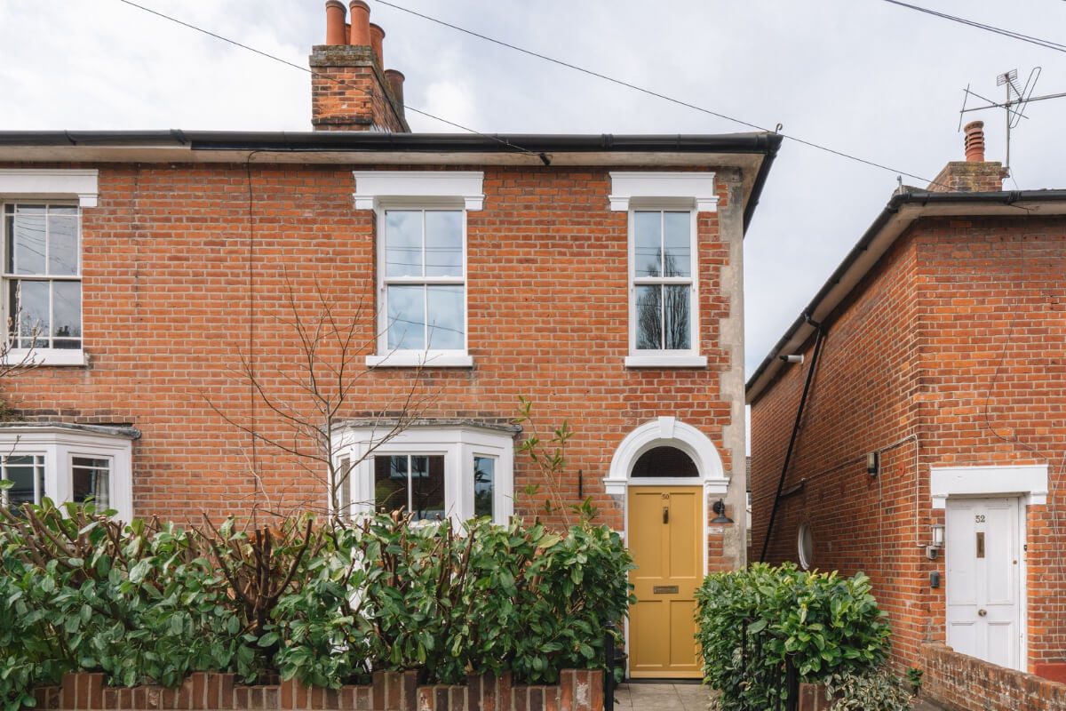 A Kitchen with Terracotta Tiles in a Renovated English Home 26 exterior yellow front door