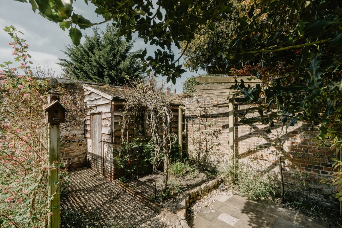 Serene Colors and Historic Elements in an Elizabethan Home in Wiltshire 27 garden shed